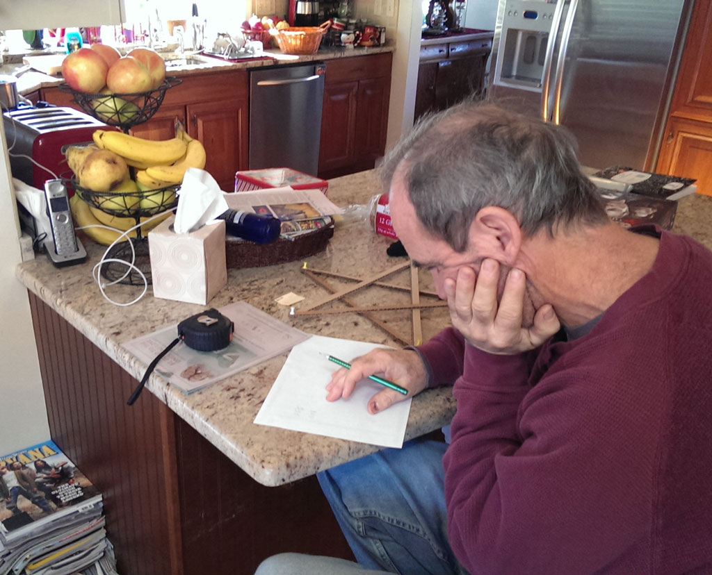 Johnny building star out of cardboard.